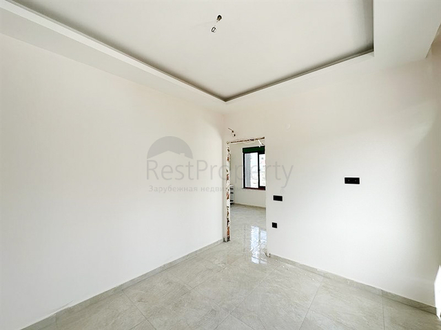 1+1 Wohnung in einem im Bau befindlichen Haus im Stadtteil Mahmutlar