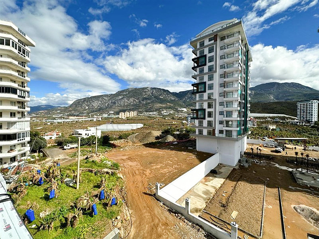 1+1 Wohnung in einem im Bau befindlichen Haus im Stadtteil Mahmutlar