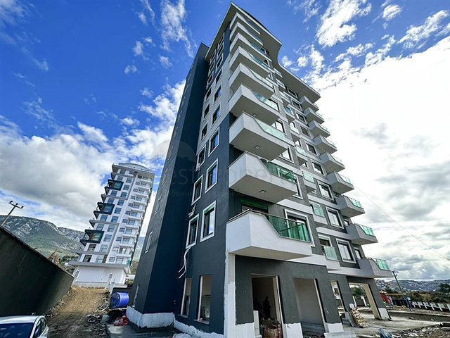 1+1 Wohnung in einem im Bau befindlichen Haus im Stadtteil Mahmutlar