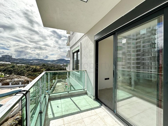 1+1 Wohnung in einem im Bau befindlichen Haus im Stadtteil Mahmutlar