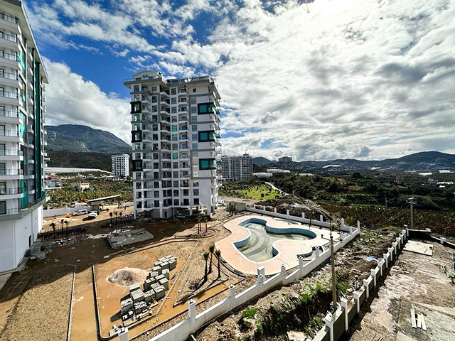 1+1 Wohnung in einem im Bau befindlichen Haus im Stadtteil Mahmutlar