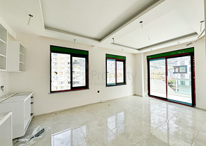 1+1 Wohnung in einem im Bau befindlichen Haus im Stadtteil Mahmutlar