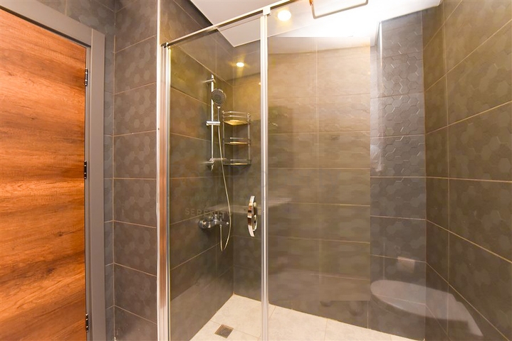 1+1 Apartment in einem Komplex mit Hotelinfrastruktur im Stadtteil Mahmutlar