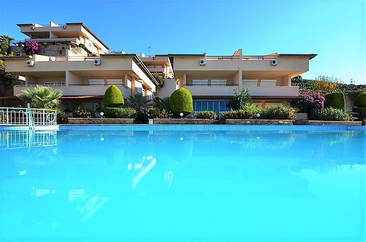 Gemütliche 2+1 Wohnung mit eigenem Gartengrundstück