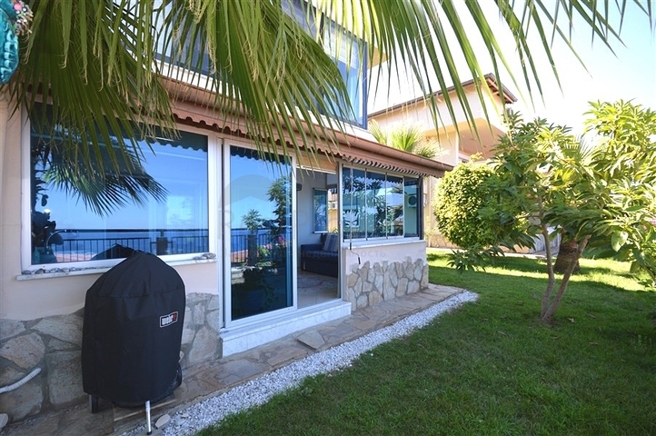 Gemütliche 2+1 Wohnung mit eigenem Gartengrundstück