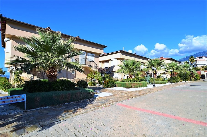 Gemütliche 2+1 Wohnung mit eigenem Gartengrundstück