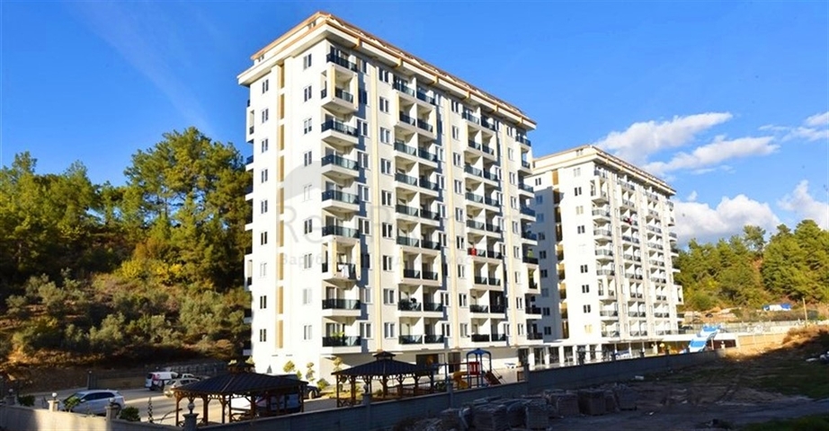 Neue 1+1 Wohnung umgeben von Pinienwäldern in einem Komplex mit reicher Infrastruktur Neue 1+1 Wohnung umgeben von Pinienwäldern in einem Komplex mit reicher Infrastruktur