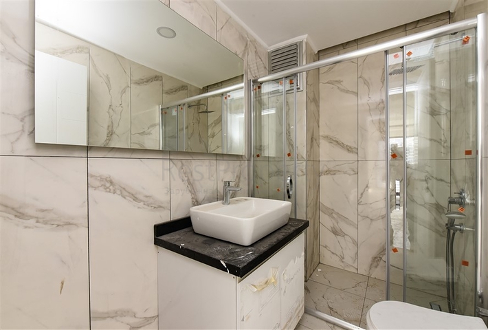 1+1 Wohnung mit Berg- und Meerblick im Stadtteil Mahmutlar