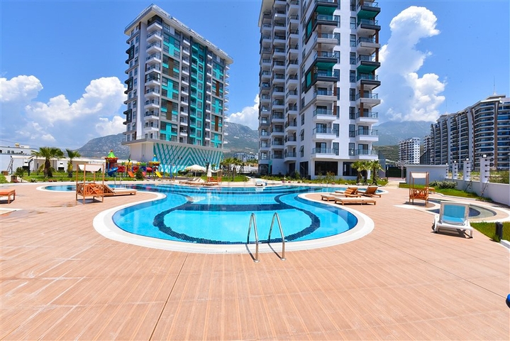 1+1 Wohnung mit Berg- und Meerblick im Stadtteil Mahmutlar