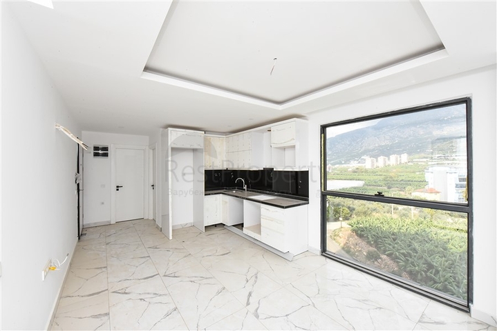 1+1 Wohnung mit Berg- und Meerblick im Stadtteil Mahmutlar