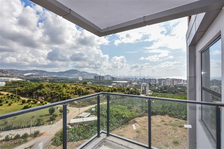 1+1 Wohnung mit Berg- und Meerblick im Stadtteil Mahmutlar