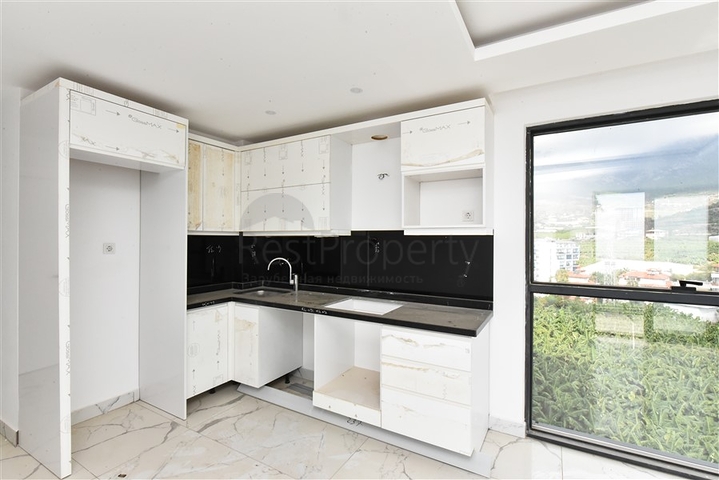 1+1 Wohnung mit Berg- und Meerblick im Stadtteil Mahmutlar