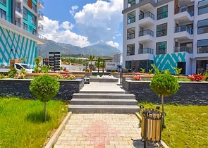 1+1 Wohnung mit Berg- und Meerblick im Stadtteil Mahmutlar