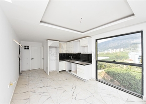 1+1 Wohnung mit Berg- und Meerblick im Stadtteil Mahmutlar