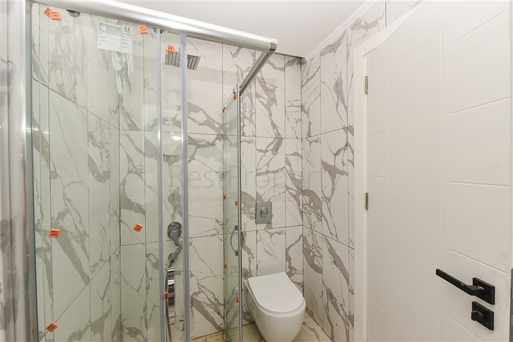 1+1 Wohnung in einem neuen Haus im Stadtteil Mahmutlar