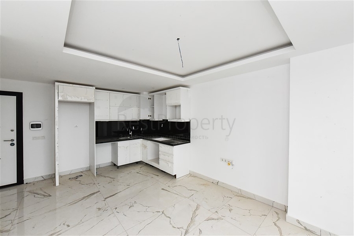 1+1 Wohnung in einem neuen Haus im Stadtteil Mahmutlar