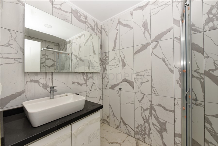 1+1 Wohnung in einem neuen Haus im Stadtteil Mahmutlar