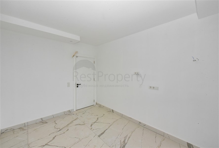 1+1 Wohnung in einem neuen Haus im Stadtteil Mahmutlar