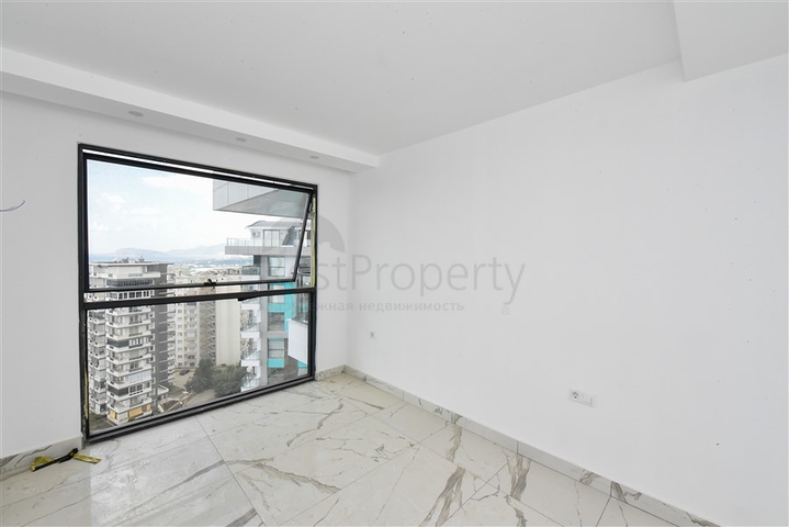 1+1 Wohnung in einem neuen Haus im Stadtteil Mahmutlar