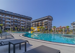 3+1 Wohnung in einem neuen Komplex mit einem großen Grundstück