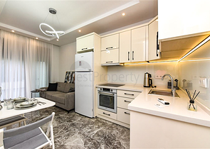 Zweizimmerwohnung mit Zugang zum Garten im Zentrum von Alanya