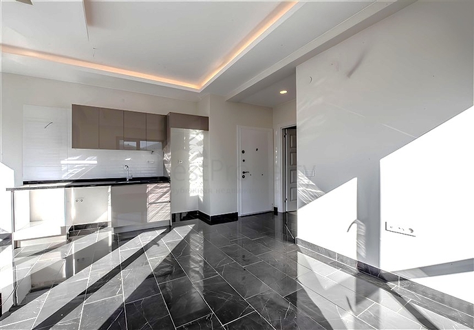 1+1 Wohnung in einer neuen Wohnanlage im Bezirk Mahmutlar zu einem günstigen Preis 