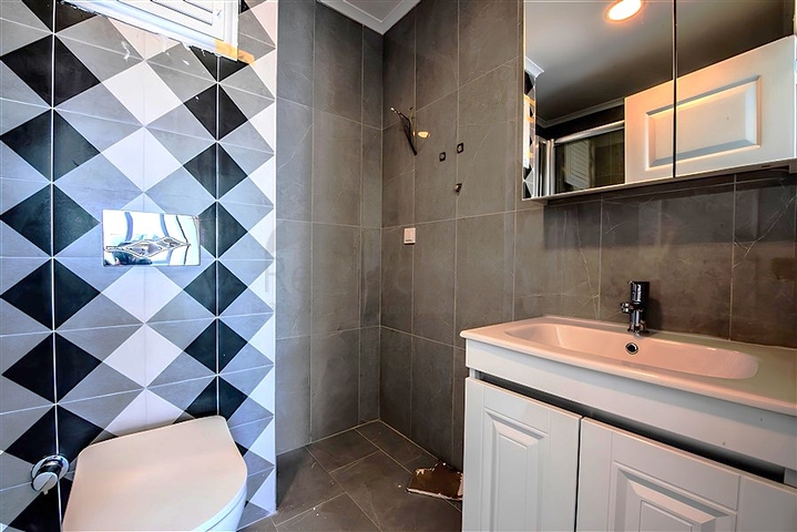 1+1 Wohnung in einer neuen Wohnanlage im Bezirk Mahmutlar zu einem günstigen Preis 