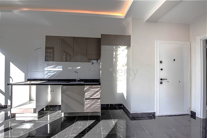 1+1 Wohnung in einer neuen Wohnanlage im Bezirk Mahmutlar zu einem günstigen Preis 