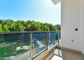 Gemütliche 1+1 Wohnung in einer Anlage umgeben von Nadelwäldern in Avsallar