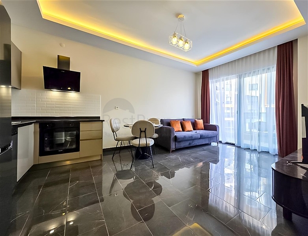 Mieten Sie eine gemütliche 1+1 Wohnung mit reicher Infrastruktur im Herzen von Mahmutlar Mieten Sie eine gemütliche 1+1 Wohnung mit reicher Infrastruktur im Herzen von Mahmutlar