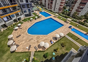 Mieten Sie eine gemütliche 1+1 Wohnung mit reicher Infrastruktur im Herzen von Mahmutlar Mieten Sie eine gemütliche 1+1 Wohnung mit reicher Infrastruktur im Herzen von Mahmutlar