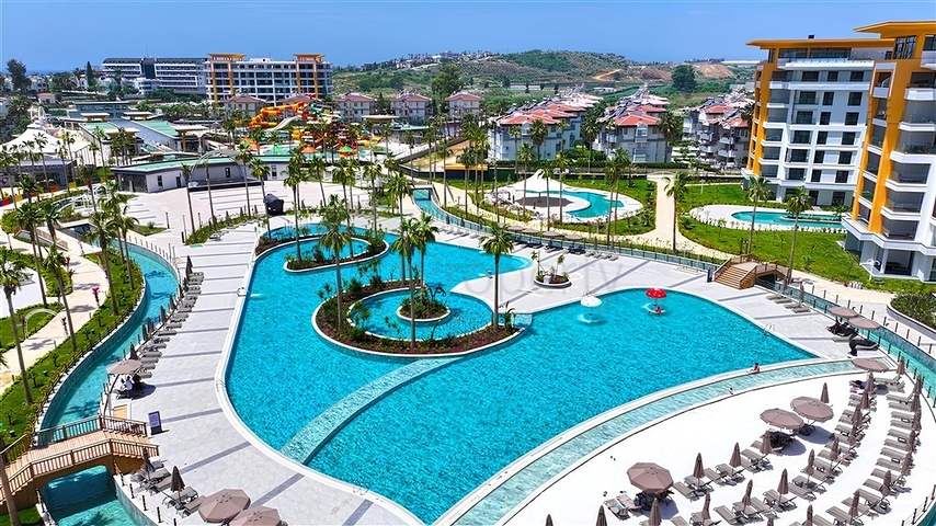 Luxuriöse 3+1-Wohnung mit Garten in einem Luxus-Komplex am Meer