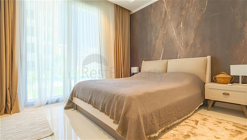 Luxuriöse 3+1-Wohnung mit Garten in einem Luxus-Komplex am Meer