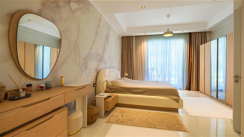 Luxuriöse 3+1-Wohnung mit Garten in einem Luxus-Komplex am Meer