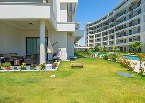 Luxuriöse 3+1-Wohnung mit Garten in einem Luxus-Komplex am Meer