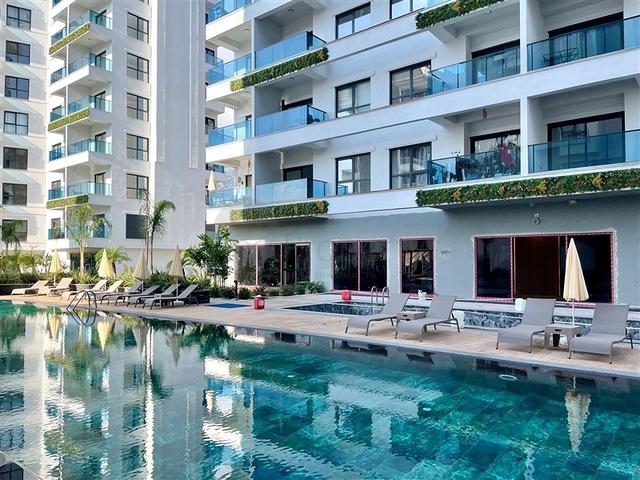 Moderne 1+1-Wohnung in einem neuen Komplex mit Pool und Spa-Bereich in Mahmutlar